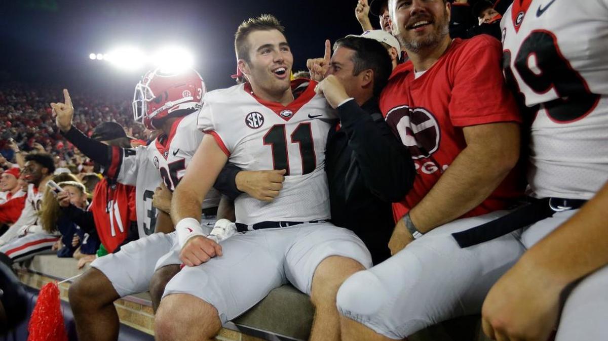 Georgia quarterback Jake Fromm (11) celebrates in the stands following the team's 20-19 win over Notre Dame in an NCAA college football game in South Bend, Ind., Saturday, Sept. 9, 2017.