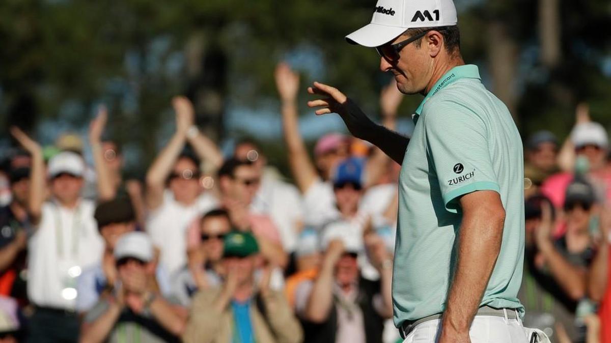 Justin Rose reacts after making a birdie putt on the 18th hole Saturday.