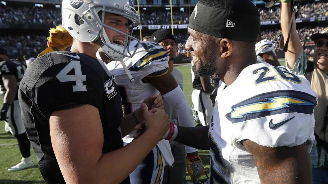 Oakland Raiders quarterback Derek Carr (4) greets San Diego Chargers cornerback Casey Hayward after Sunday’s game.