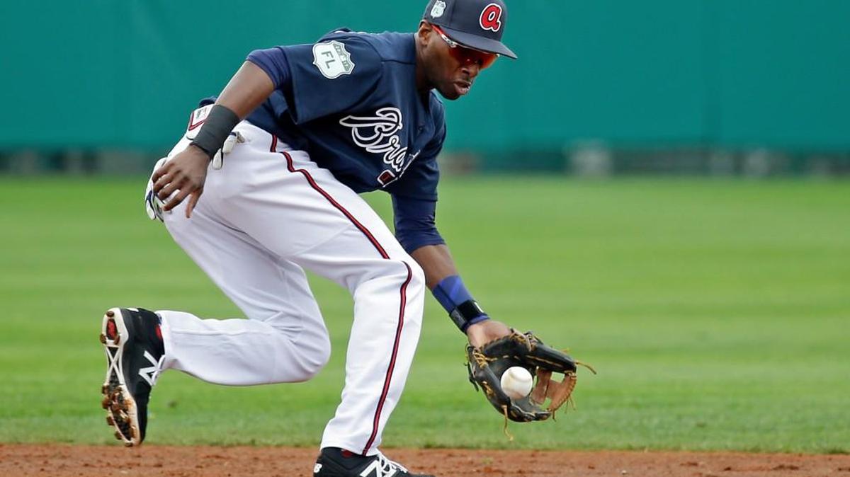 Atlanta Braves infielder Travis Demeritte fields a ground ball in a spring training baseball workout ,Tuesday, Feb. 21, 2017, in Kissimmee, Fla.