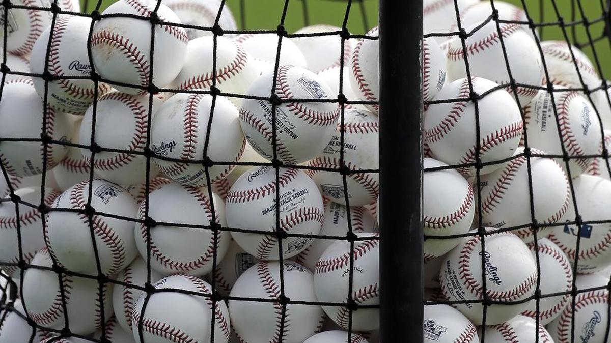 Baseballs in a basket used for Atlanta Braves batting practice are seen at a baseball spring training workout, Wednesday, Feb. 15, 2017, in Lake Buena Vista, Fla.