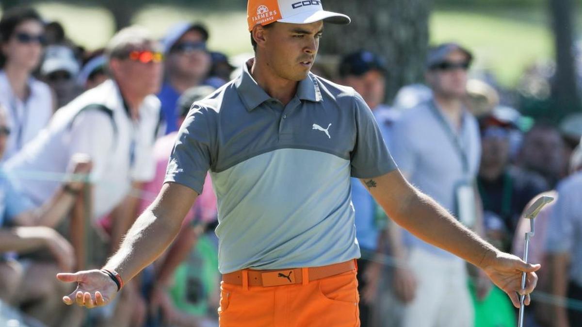 Rickie Fowler reacts to a put on the seventh hole during the final round of the Masters on Sunday.