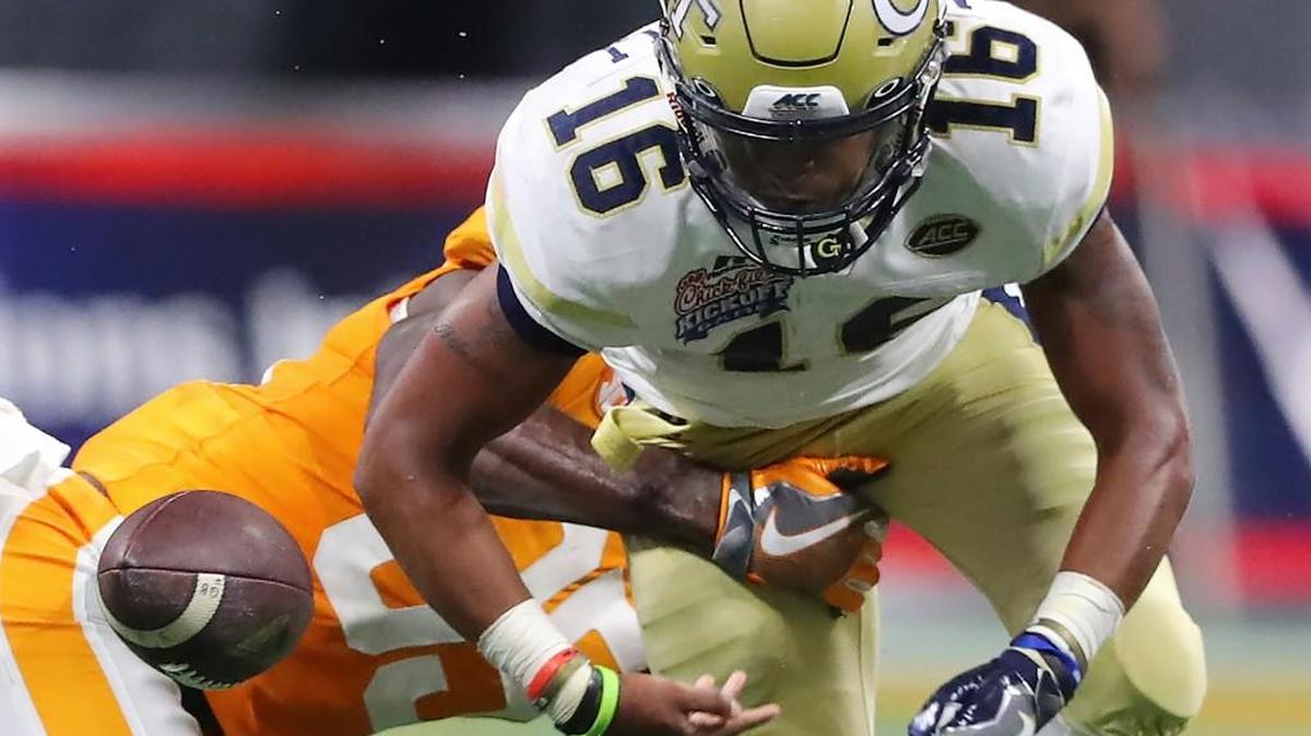 Tennessee linebacker Daniel Bituli strips the ball as he tackles Georgia Tech quarterback TaQuon Marshall on Monday.