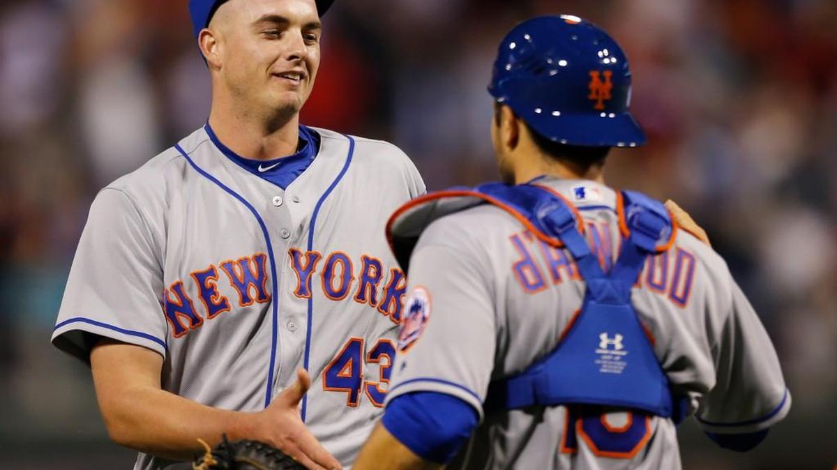 New York relief pitcher Addison Reed (43) is congratulated by catcher Travis d'Arnaud after the end of the Mets’ win over Philadelphia.