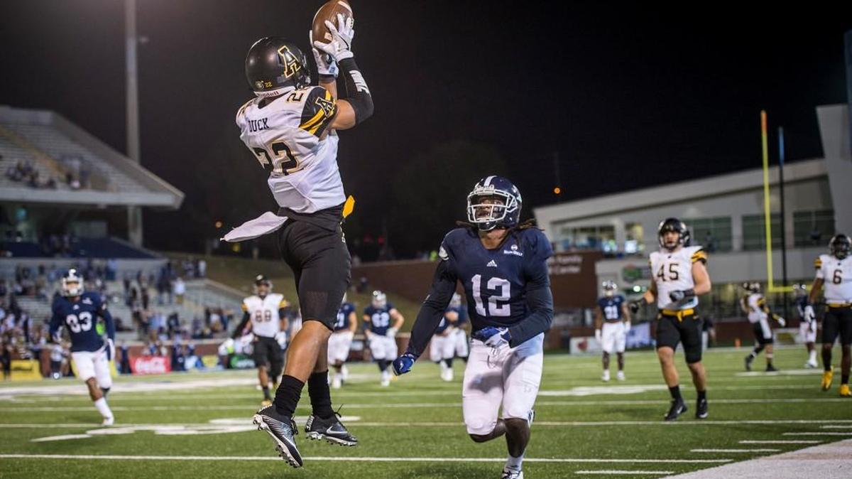 Appalachian State's Clifton Duck (22) intercepts a Georgia pass as intended receiver BJ Johnson III looks on during Thursday night’s Sun Belt Conference gme.