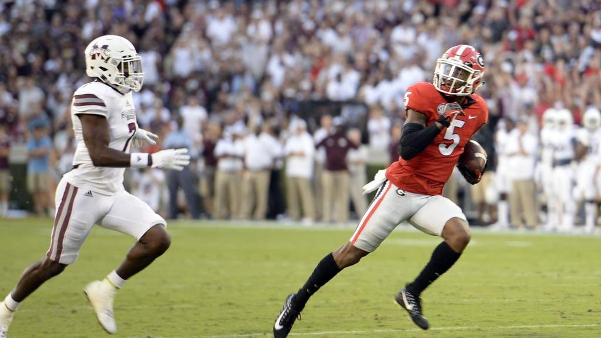 Georgia receiver Terry Godwin looks back as he heads to the end zone with a Jake Fromm bomb for the first score of the game against Mississippi State. Go to macon.com for complete game coverage.
