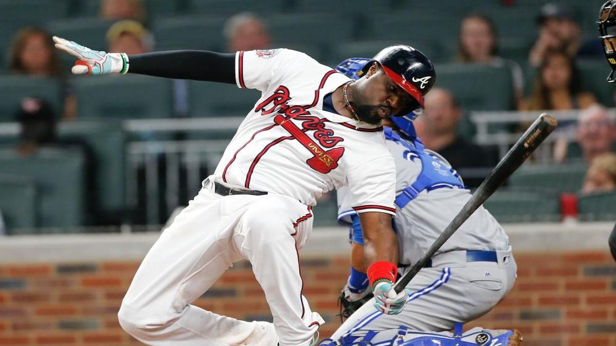 Atlanta Braves' Brandon Phillips loses his balance as he swings and misses at a pitch during the fifth inning of a baseball game against the Toronto Blue Jays ' Thursday, May 18, 2017, in Atlanta. Toronto won 9-0.