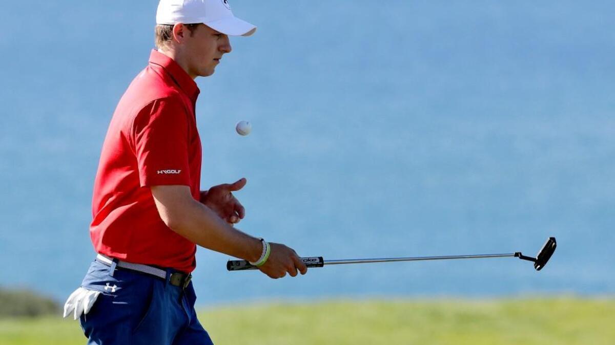 Jordan Spieth picks up his ball on the 10th green during the pro-am tournament prior to the Tournament of Champions golf event, Wednesday, Jan. 4, 2017, at Kapalua Plantation Course in Kapalua, Hawaii.
