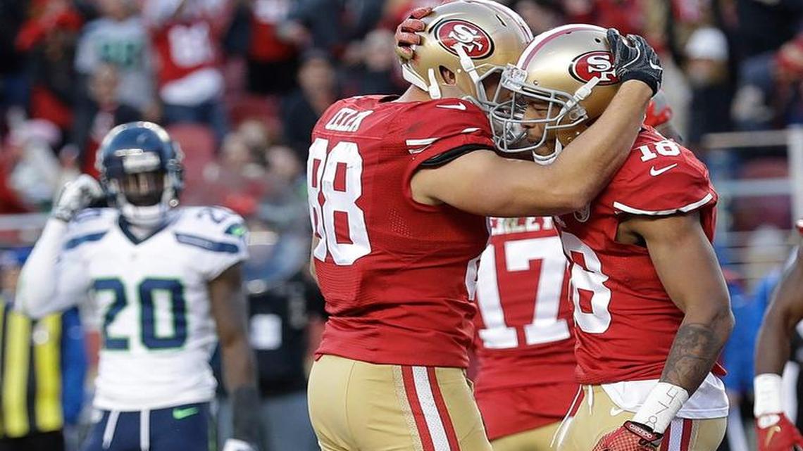 San Francisco 49ers tight end Garrett Celek (88) celebrates after scoring a touchdown with DeAndre Smelter during the second half of an NFL football game against the Seattle Seahawks in Santa Clara, Calif., Sunday, Jan. 1, 2017.