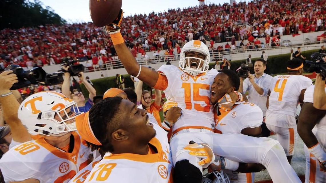 Tennessee wide receiver Jauan Jennings (15) is carried by teammates Kyle Phillips (5) and Charles Mosley (78) after making a last-second touchdown catch to defeat Georgia 34-31 in October.