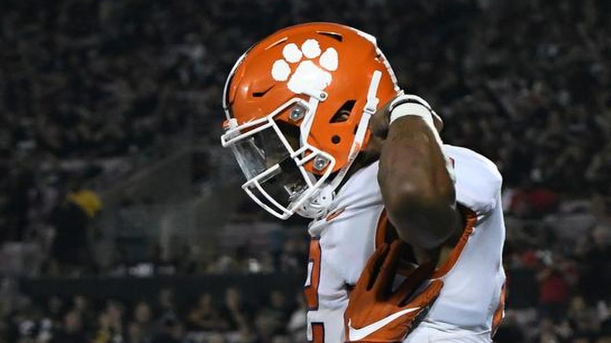 Clemson's linebacker Christian Wilkins (42) holds up Kelly Bryant (2) following his touchdown during the second half of their NCAA college football game against Louisville, Saturday, Sept. 16, 2017, in Louisville, Ky. Clemson won 47-21.