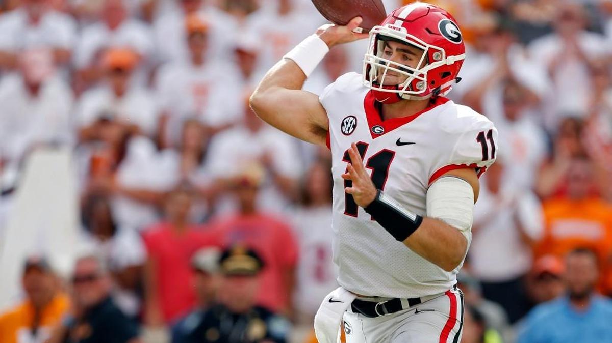 Georgia quarterback Jake Fromm (11) throws to a receiver during the first half of an NCAA college football game against Tennessee Saturday, Sept. 30, 2017, in Knoxville, Tenn. Fromm threw a touchdown pass and ran for two more scores Saturday as No. 7 Georgia rolled to a 41-0 blowout of Tennessee, which suffered its first shutout loss in nearly a quarter-century.