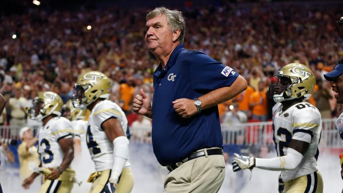 Georgia Tech head coach Paul Johnson runs onto the field with his players before in the first half of an NCAA college football game against the Tennessee Monday, Sept. 4, 2017, in Atlanta.