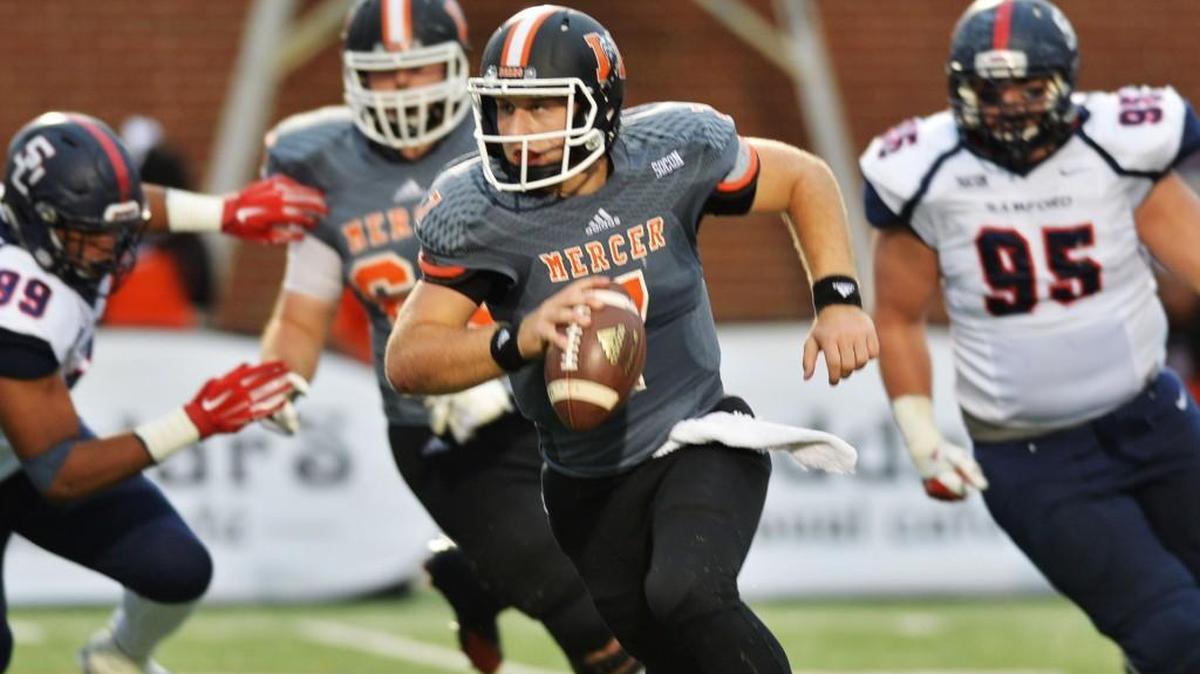 Mercer quarterback John Russ, front, and the Bears have won three Southern Conference games in two seasons.