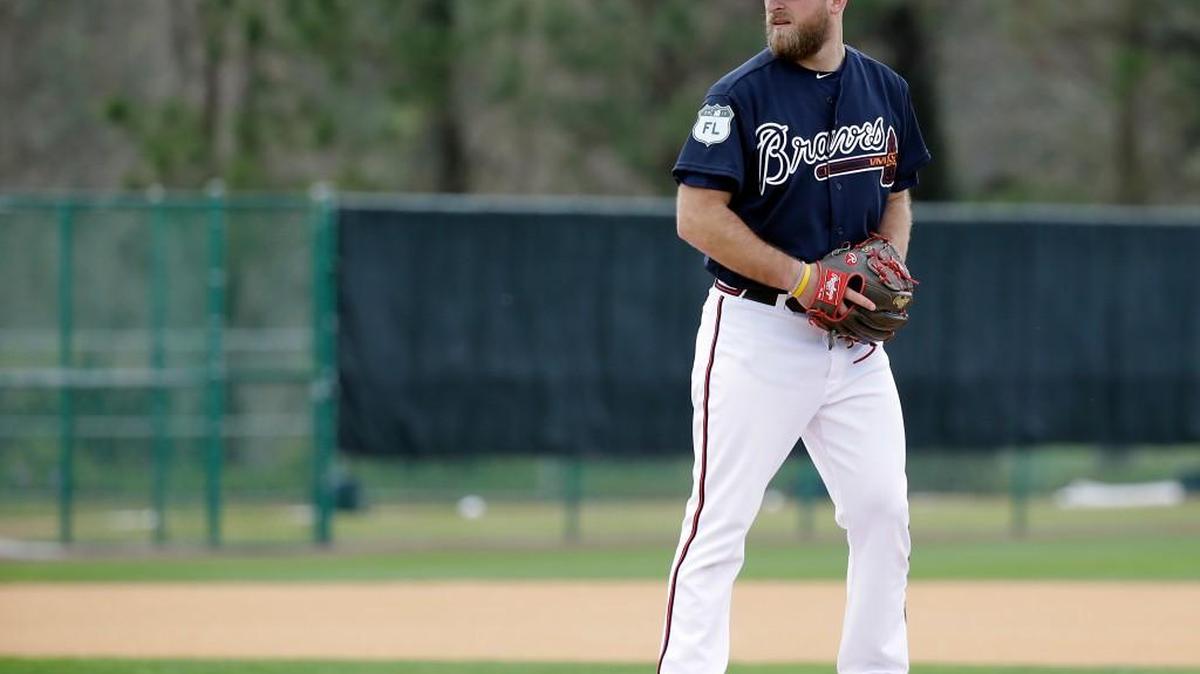 Atlanta Braves relief pitcher Ian Krol performs an infield drill at a baseball spring training workout, Wednesday, Feb. 15, 2017, in Lake Buena Vista, Fla.