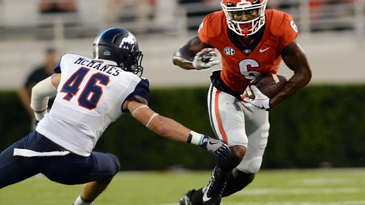 Georgia receiver Javon Wims (6) tries to make his way past Samford's Carter McManes (46).