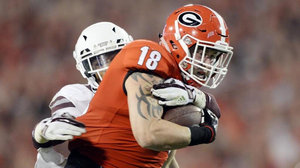 Georgia tight end Isaac Nauta (18) catches a pass from Jake Fromm and fights off Mississippi State defensive back Mark McLaurin (41) for a touchdown. Georgia beat Mississippi State, 31-3.