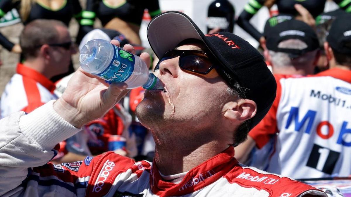 Kevin Harvick drinks water after winning the NASCAR Sprint Cup Series auto race Sunday, June 25, 2017, in Sonoma, Calif.