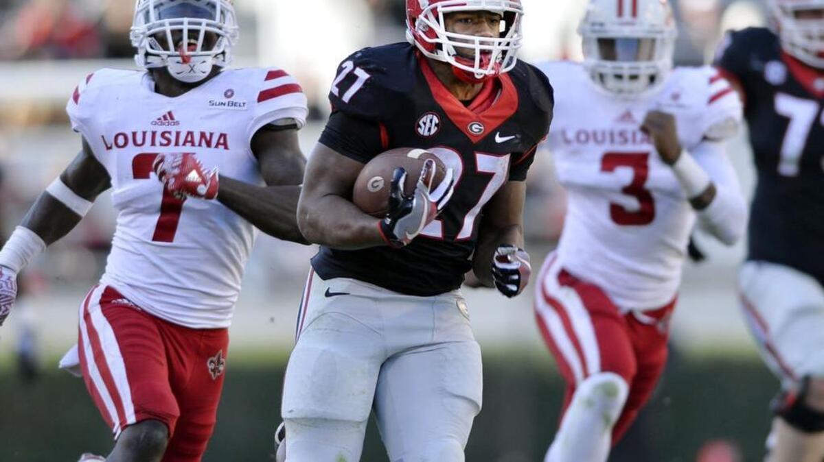Georgia running back Nick Chubb (27) turns a short pass into a 49-yard touchdown during fourth-quarter action Saturday against Louisiana-Lafayette.