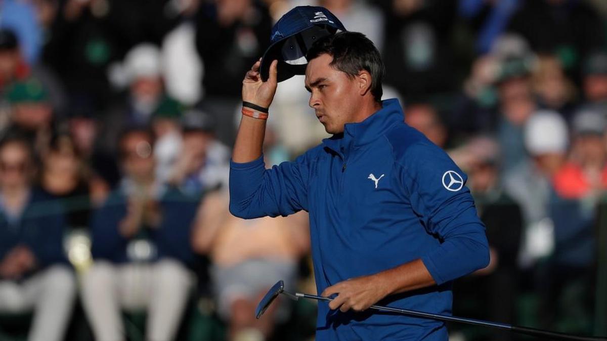 Rickie Fowler tips his hat on the 18th green during the second round of the Masters golf tournament Friday, April 7, 2017, in Augusta.