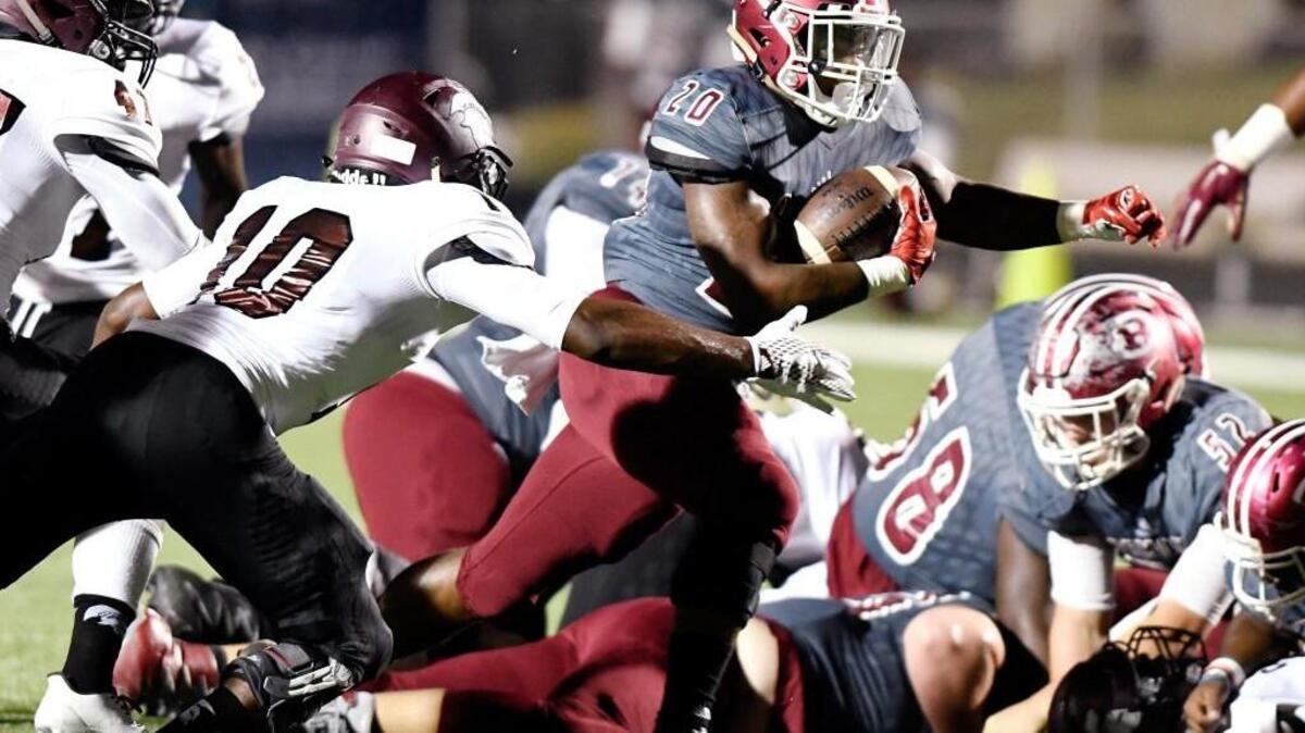Warner Robins running back Jarius Burnette (20) and the Demons travel to Thomas County Central on Friday.