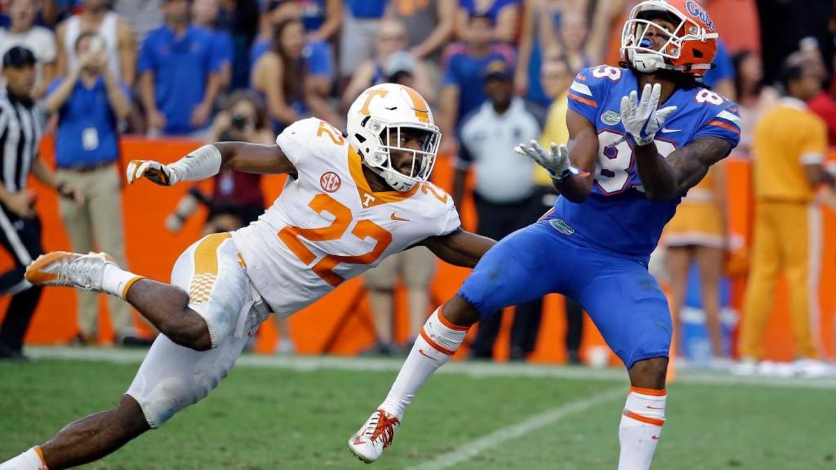 Florida wide receiver Tyrie Cleveland, right, catches the game winning 63-yard touchdown pass in front of Tennessee defensive back Micah Abernathy (22) as time expired in the fourth quarter of an NCAA college football game, Saturday, Sept. 16, 2017, in Gainesville, Fla. Florida won 26-20.