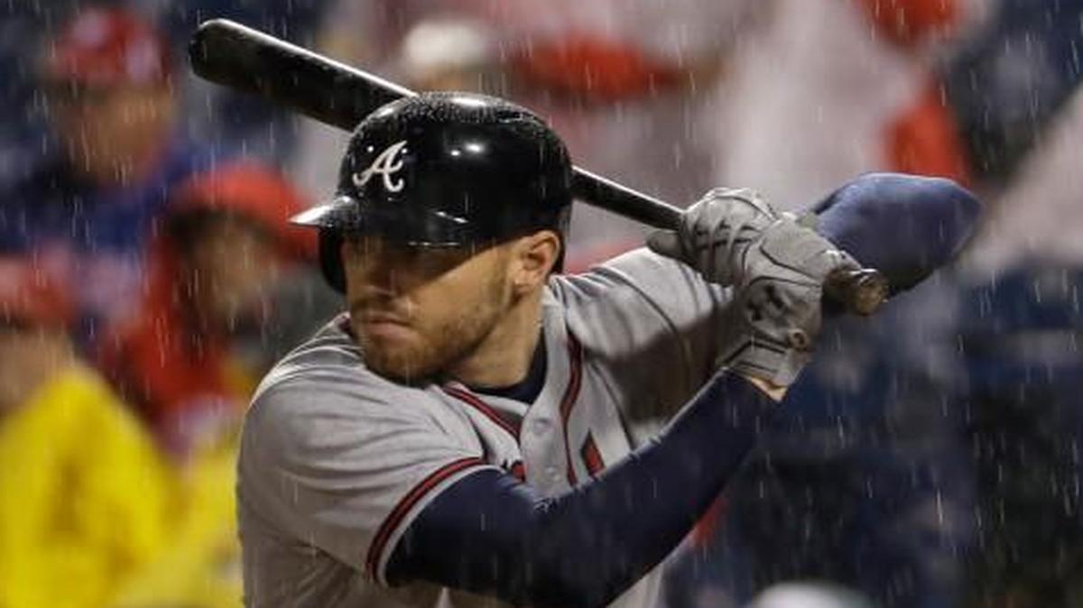 Atlanta Braves' Freddie Freeman bats in a rain shower during the fourth inning of a baseball game against the Philadelphia Phillies, Friday, April 21, 2017, in Philadelphia.