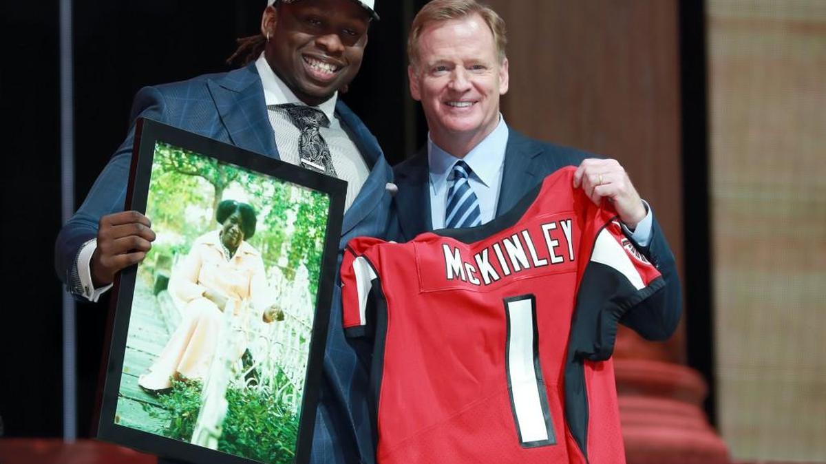 UCLA's Takkarist McKinley, left, poses with NFL commissioner Roger Goodell after being selected by the Atlanta Falcons during the first round of the 2017 NFL football draft, Thursday, April 27, 2017, in Philadelphia.