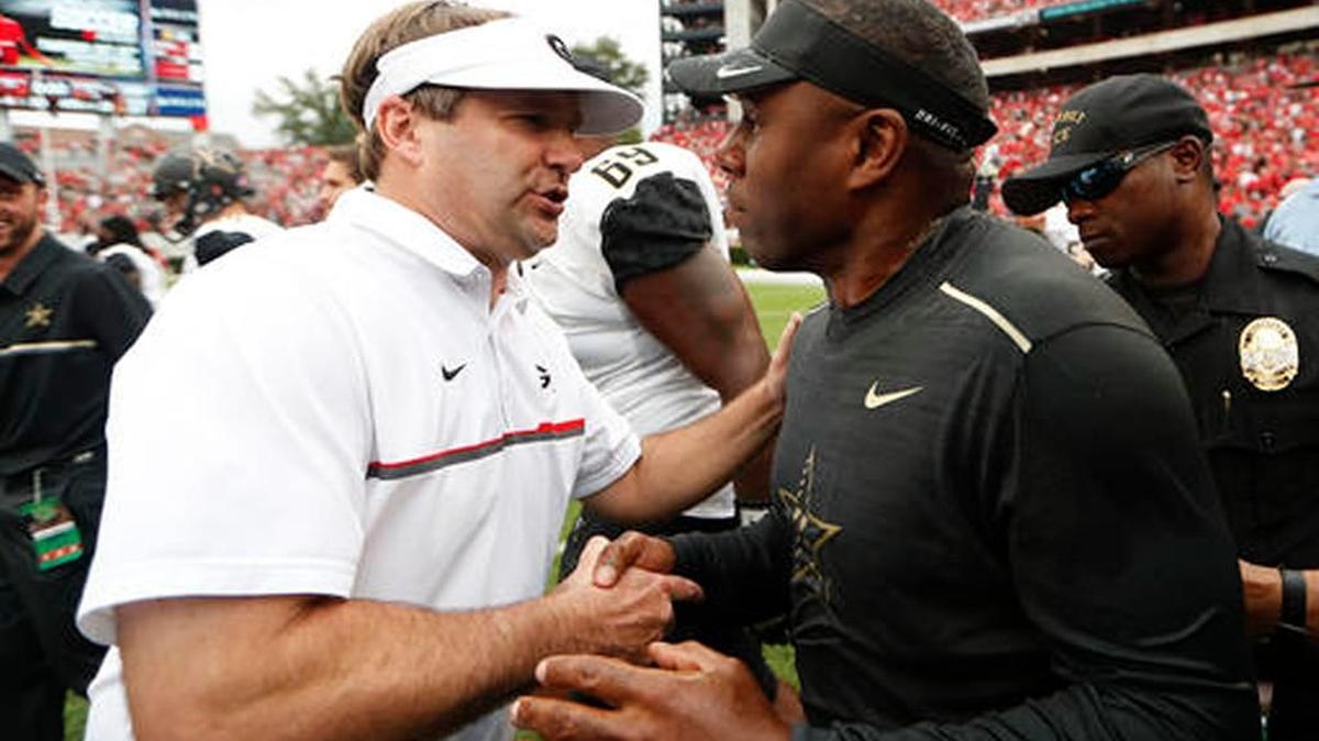 Georgia head coach and former Bulldogs player Kirby Smart, left, gets his first taste of the Georgia-Florida game as the Bulldogs’ head coach Saturday.