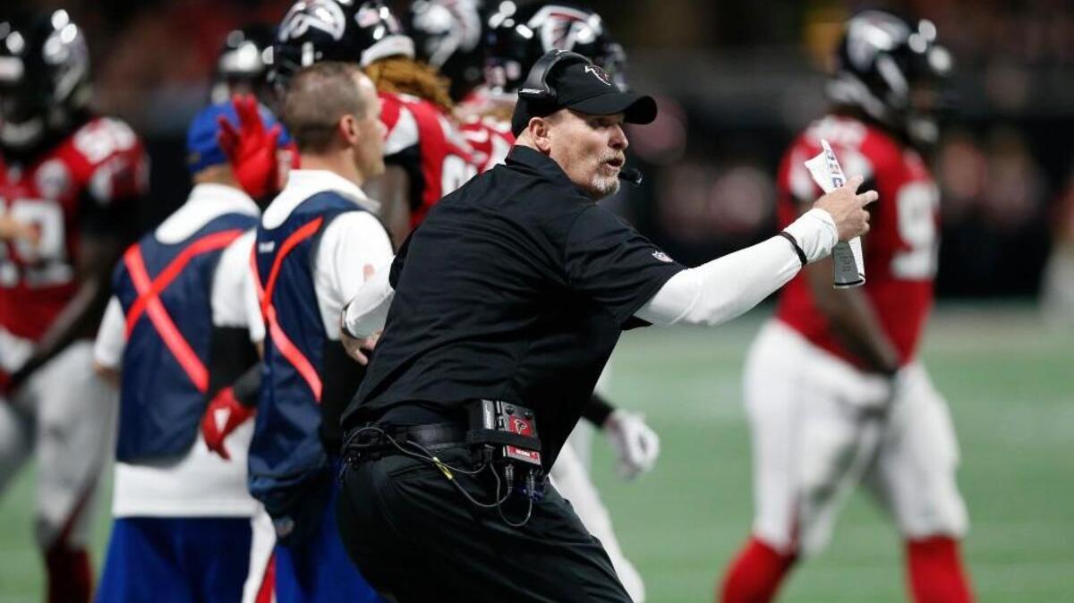 Atlanta Falcons head coach Dan Quinn speaks to players against the Green Bay Packers during the first of an NFL football game, Sunday, Sept. 17, 2017, in Atlanta.