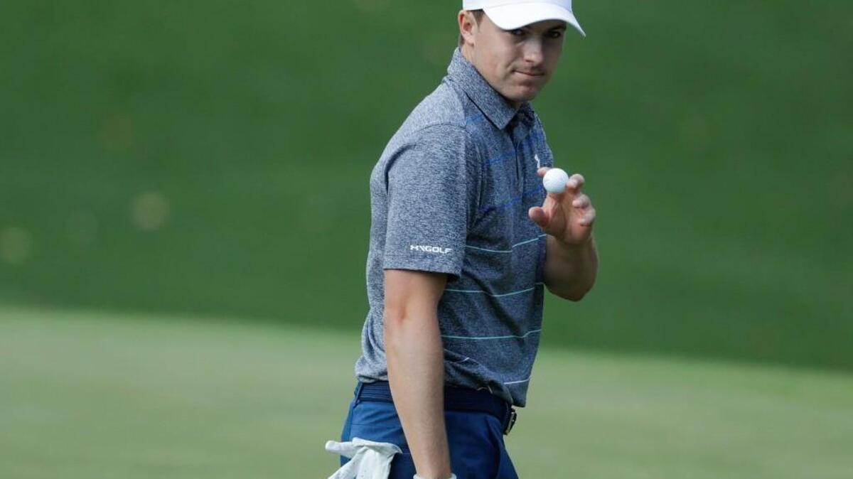Jordan Spieth waves after putting on the 10th hole during the second round of the Masters golf tournament Friday, April 7, 2017, in Augusta.