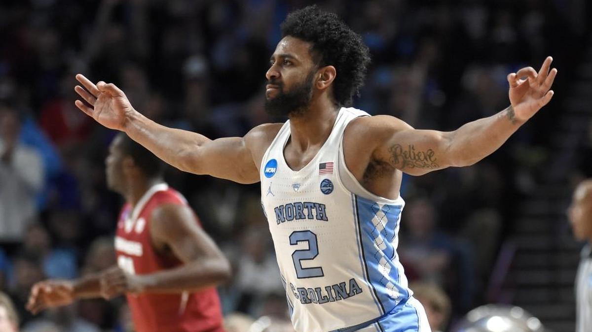 North Carolina's Joel Berry II (2) reacts after making a three-point basket against Arkansas during the first half in a second-round game of the NCAA men's college basketball tournament in Greenville, S.C.
