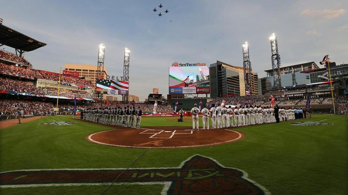 Fighter planes fly over during the national anthem for the Atlanta Braves’ home opener against the San Diego Padres at SunTrust Park in Atlanta on Friday, April 14, 2017.