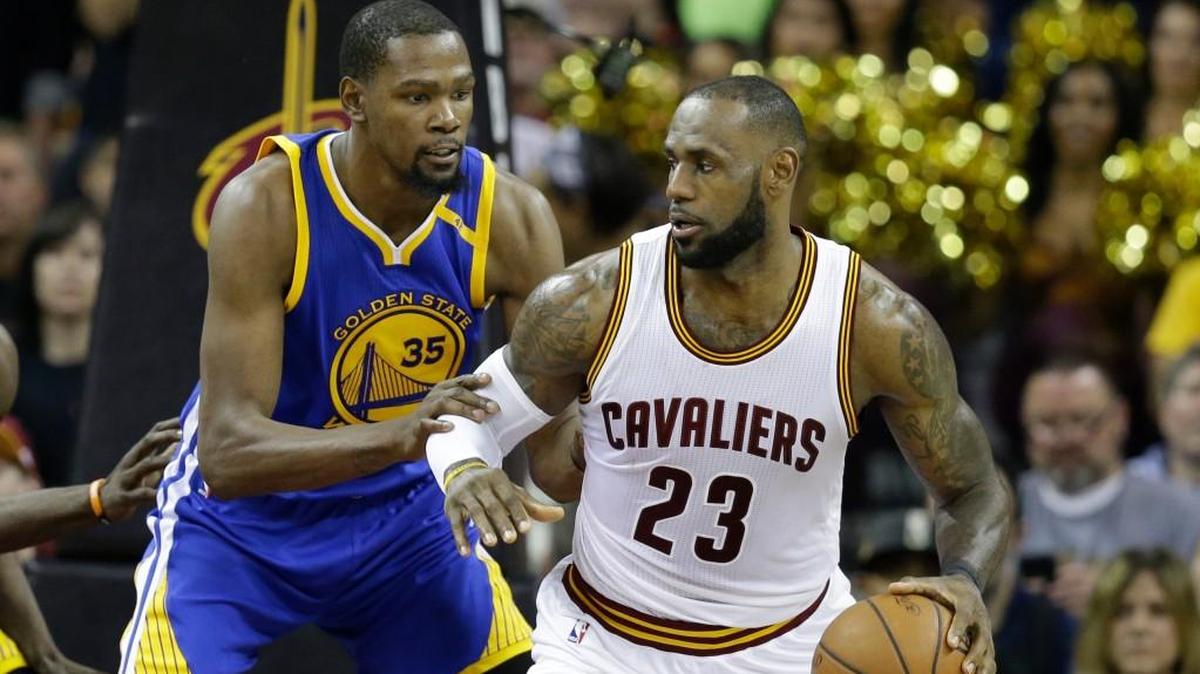 The Cavaliers' LeBron James (23) defended by the Warriors' Kevin Durant (35) during the 2017 NBA Finals. The teams meet in a record fourth straight Finals beginning Thursday night.