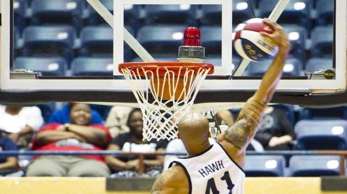 Hawk Thomas throws down a dunk during the Harlem Globetrotters’ March 8, 2016, appearance at the Macon Coliseum.